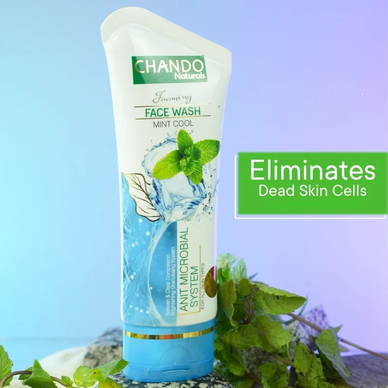 Chando Naturals face wash tube with mint leaves on a blue background