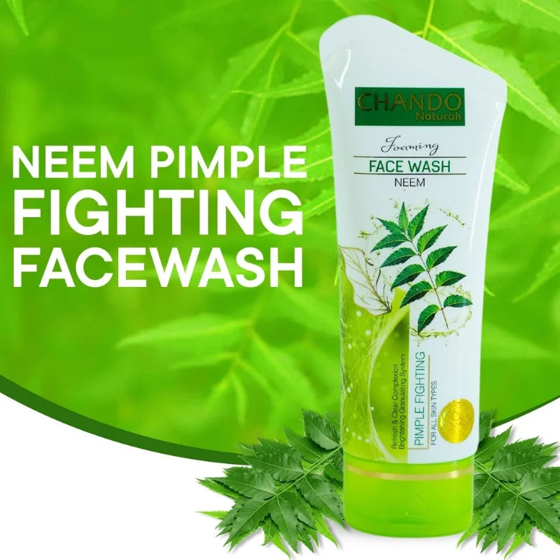 Tube of Chando Neem Pimple Fighting Face Wash with green leaves on a green background