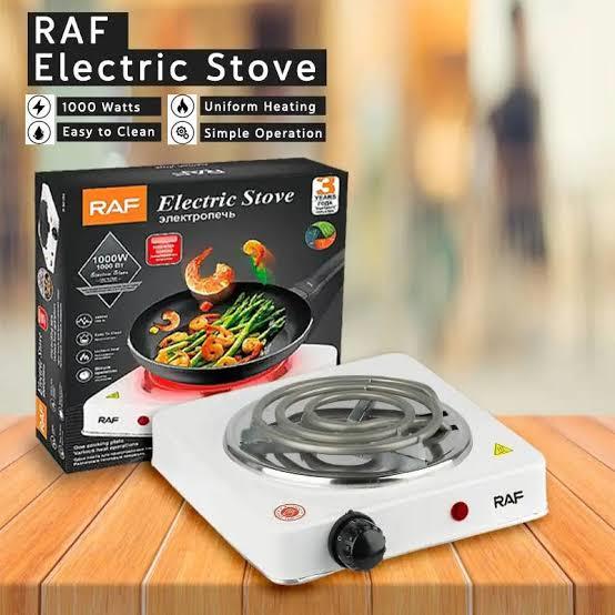 RAF electric stove with packaging on a wooden surface