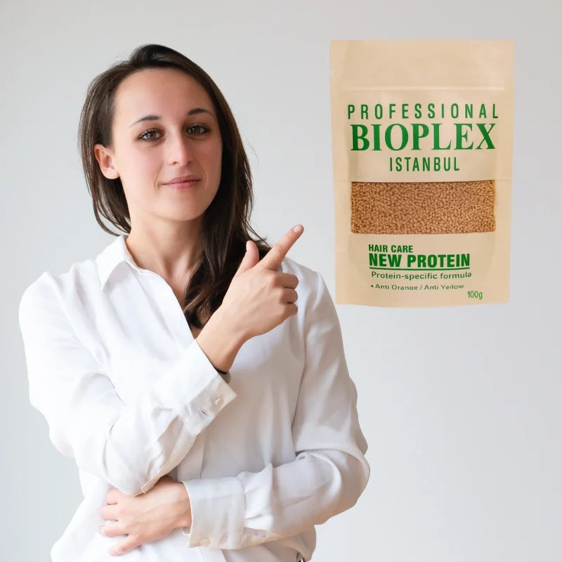 Woman pointing to a Bioplex protein package on a plain background