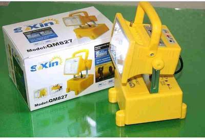 Yellow S'Xin magnetic lifting tool with packaging on a green surface