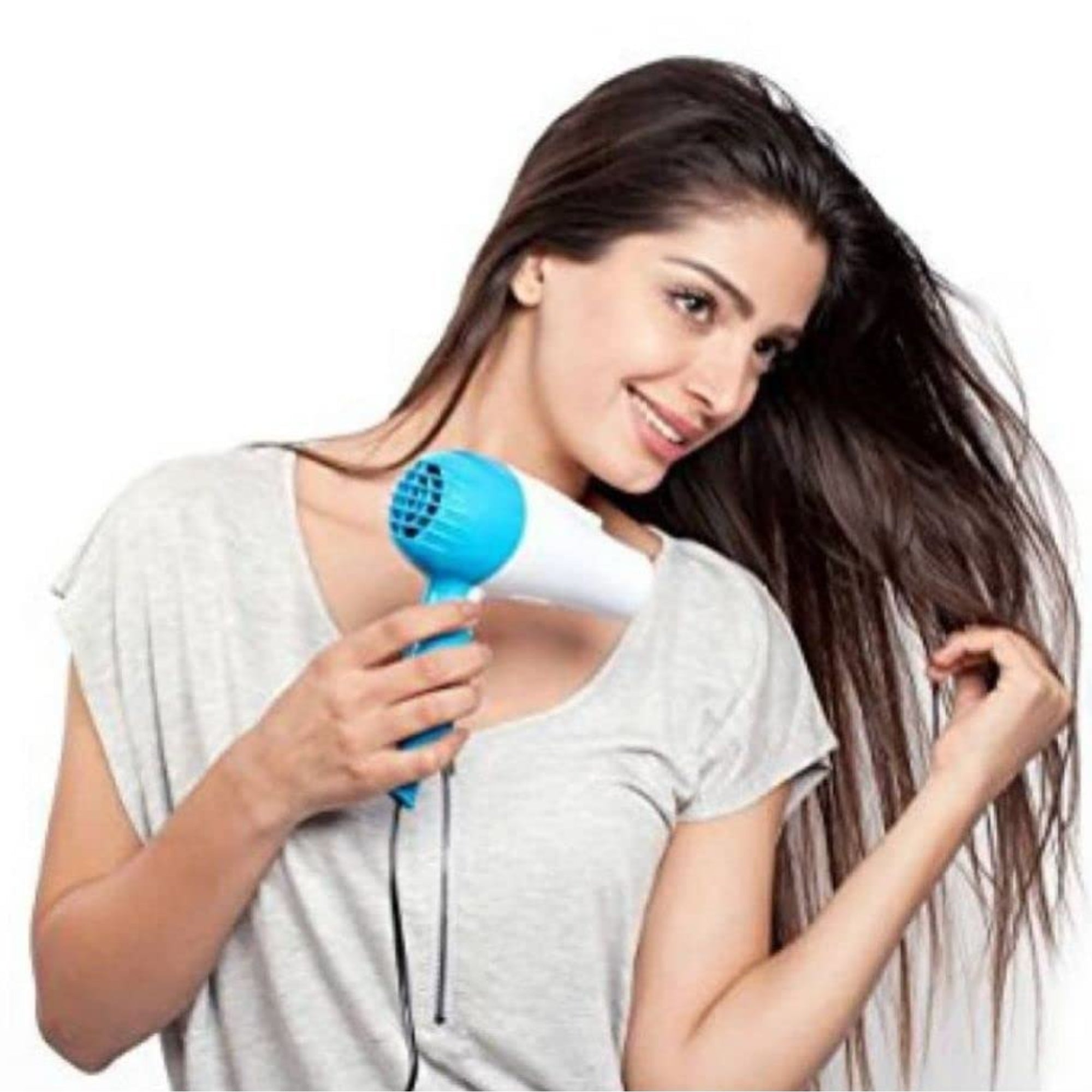 Woman holding a blue and white hair dryer with long hair on a white background