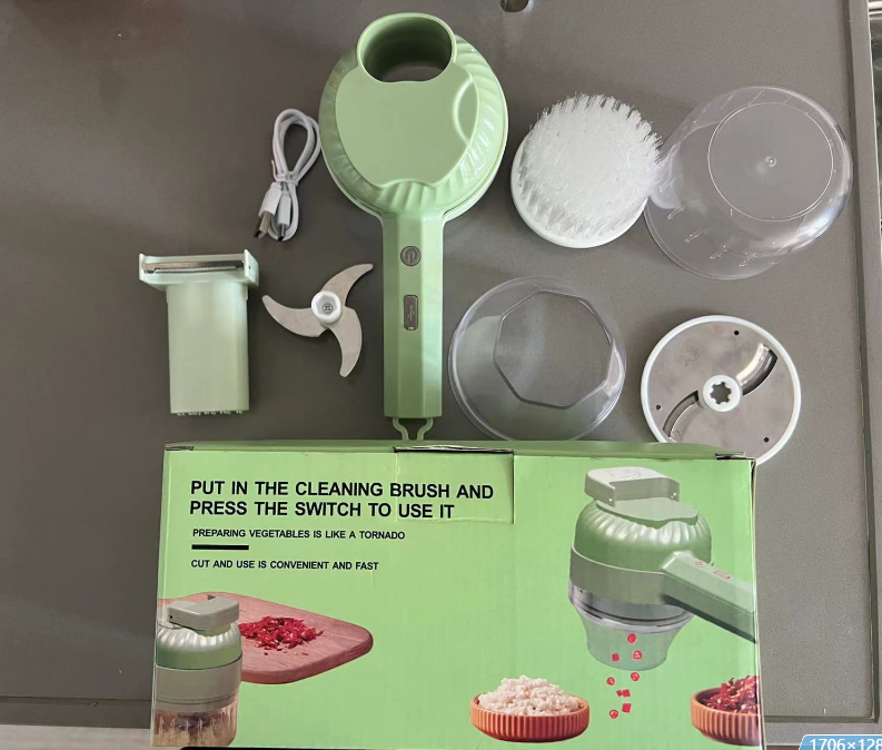 Green kitchen tool with components and packaging on a gray background