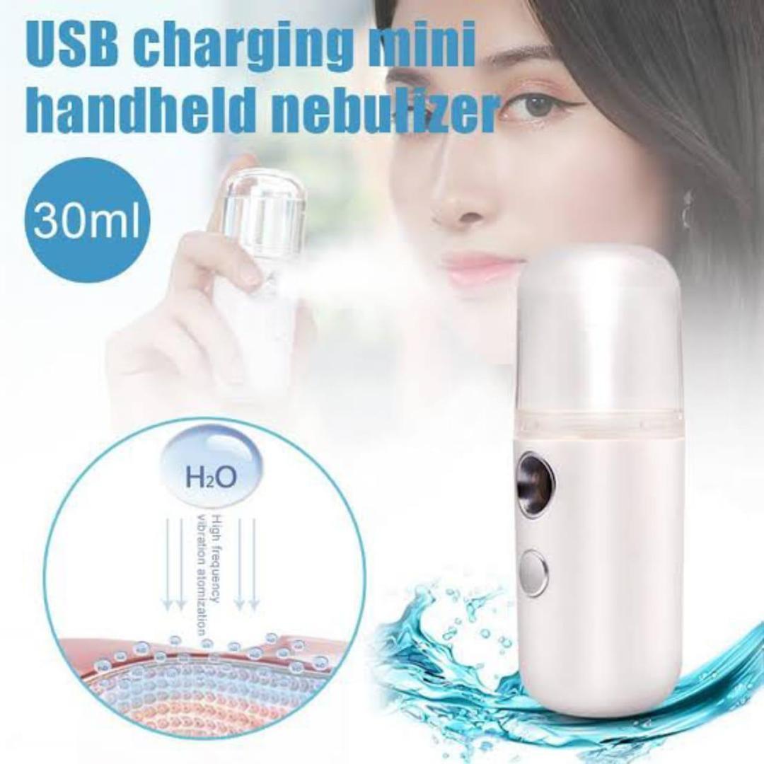 USB charging mini handheld nebulizer with a woman holding it, labeled 30ml.