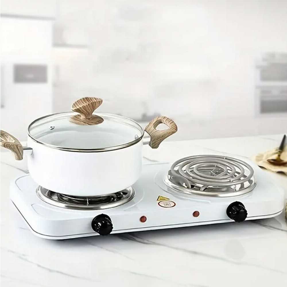 Double electric stove with a pot on a white surface