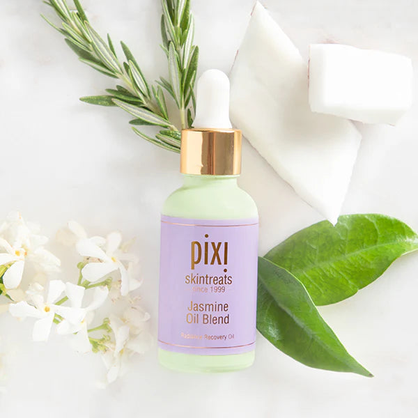  PIXI Jasmine Oil Blend bottle with green leaves and flowers on a white background