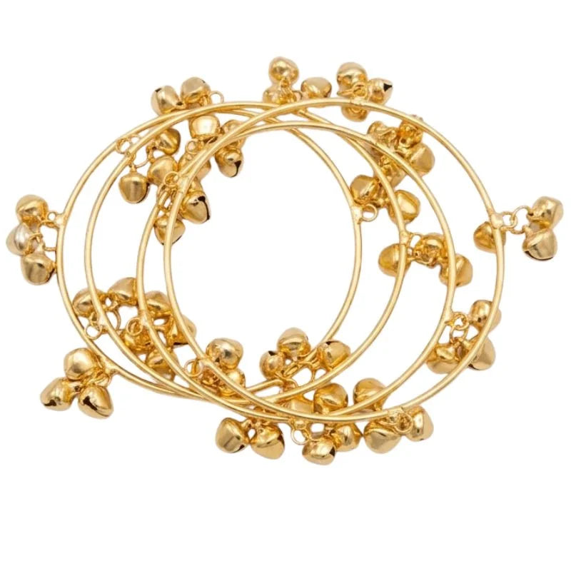 Gold hoop earrings with small ball accents on a white background
