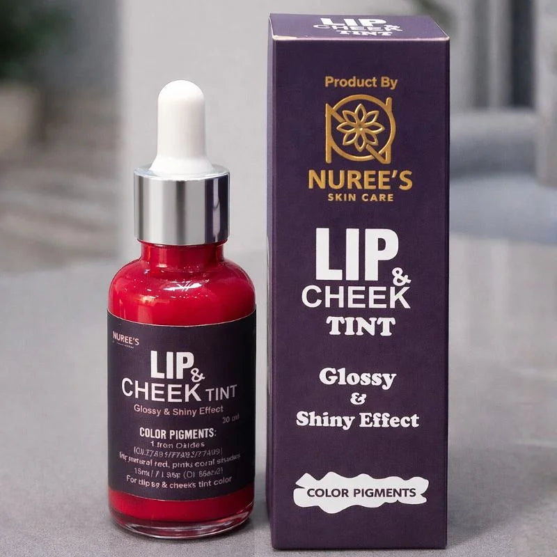 Lip and cheek tint bottle with dropper and packaging on a gray surface
